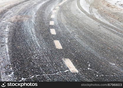 turn on a slippery frozen road in winter day