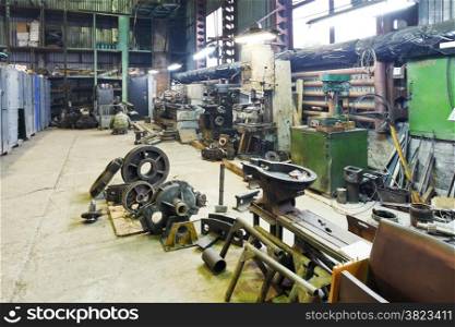 turnery mechanical workshop with lathes and parts of disassembled motor