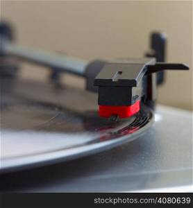 Turntable with a vinyl record, square image