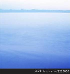 Turquoise Blue Ocean With Distant Land Mass