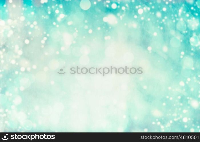 Turquoise blue winter background with bokeh and snow