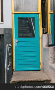 Turquoise door in typical residential house