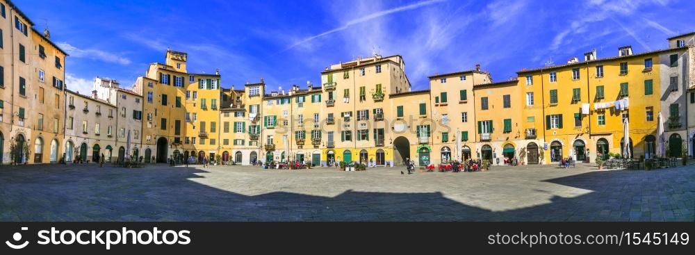 Tuscany, Italy . Beautiful colorful square - Piazza dell Anfiteatro in Lucca old town. February 2018. Landmarks of Italy, Lucca old town, Tuscany