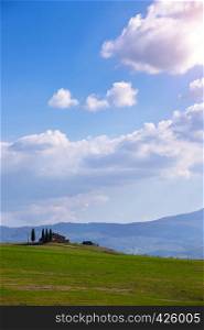 tuscany landscape with old house and cypresses at sunny day. province of Siena. Tuscany, Italy