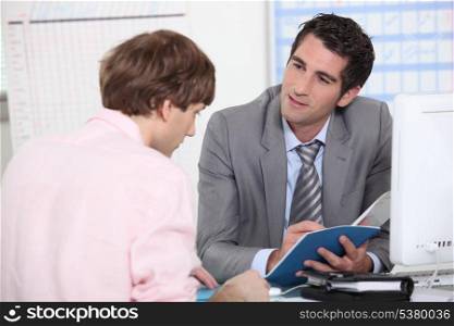 Tutor advising his student