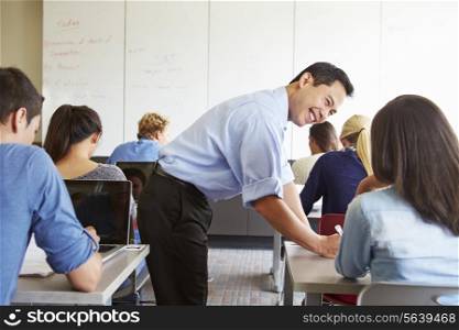Tutor Helping High School Students In Class