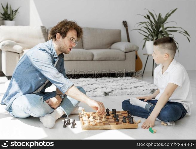 tutor learning boy how play chess