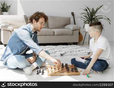 tutor learning boy how play chess