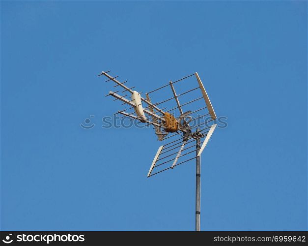 tv antenna aerial over blue sky with copy space
