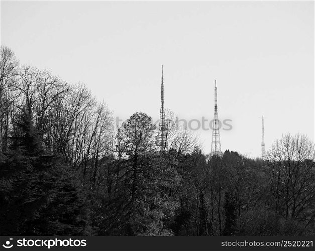 TV broadcasting towers on the hills in Turin, Italy in black and white. TV broadcasting towers in black and white