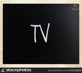 ""TV" handwritten with white chalk on a blackboard"