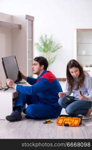 Tv repairman technician repairing tv at home