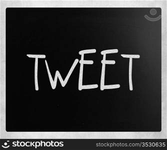 ""Tweet" handwritten with white chalk on a blackboard."