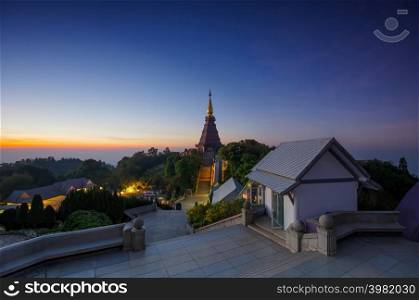 Twilight Moments sunset or sunrise Above the sacred pagoda at Doi Inthanon National Park, Chiang Mai, Thailand.. Sunrise sacred pagoda at Doi Inthanon National Park.