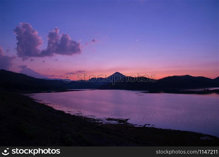 twilight sky river sunset purple color landscape lake evening time clouds and mountains background