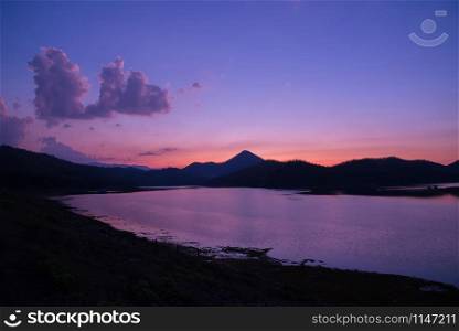 twilight sky river sunset purple color landscape lake evening time clouds and mountains background