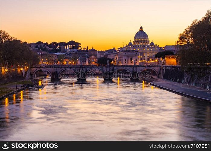 Twilight view of St. Peter&rsquo;s Basilica with Tiber River in Rome, Italy.
