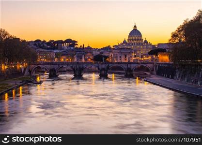 Twilight view of St. Peter&rsquo;s Basilica with Tiber River in Rome, Italy.