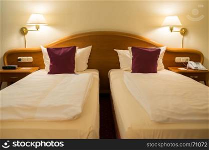 twin beds in hotel room