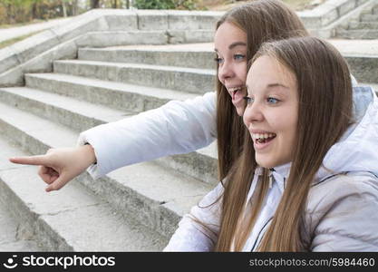 Twin girls looking at something