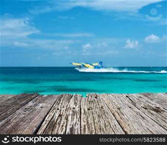 Twin otter seaplane at Maldives and old wooden pier