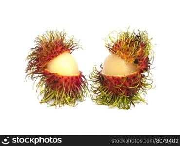 Twin partial peeled rambutans isolated over white