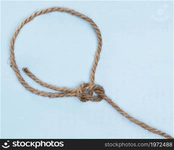 twine strong beige rope simple knot. High resolution photo. twine strong beige rope simple knot. High quality photo