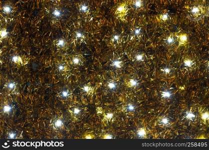 Twinkling christmas lights background. Wall illuminated by Christmas lights