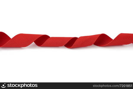 twisted red textile tape for belts and handles of bags isolated on a white background