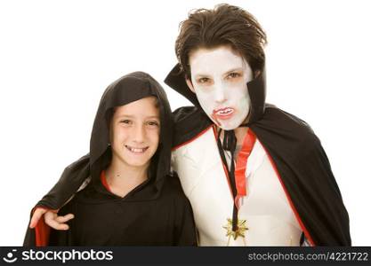 Two adorable boys in their Halloween Costumes. Isolated on white.
