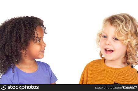 Two adorable children looking at each other isolated on a white background