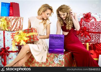 Two adorable women with Christmas presents