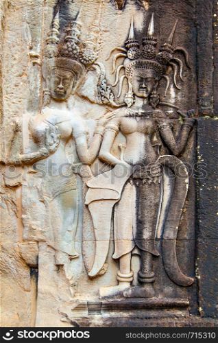 Two apsaras - ancient bas relief in Angkor Wat Temple in Cambodia