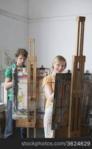 Two artists painting in studio