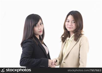 Two asian business woman in office, business handshaking profile