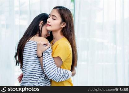 Two Asian Lesbian women looking together in bedroom. Couple people and Beauty concept. Happy lifestyles and home sweet home theme. Embracing of homosexual. Love scene making of female