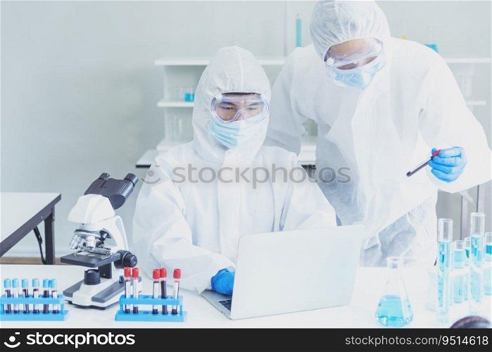 Two asian scientist team reserch chemistry science tube experiment biotech antibody s&le in laboratory Cultivate Vaccine against covid-19 virus. Scientist consult, analyze in Chemistry Laboratory