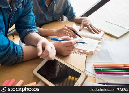 Two Asian students studying together at university