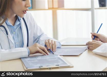 Two asian women doctors discuss meeting doctor’s office medical clinic using laptop consulting patient disease. Asian medical lab young women talking together discussing healthcare assistance teamwork
