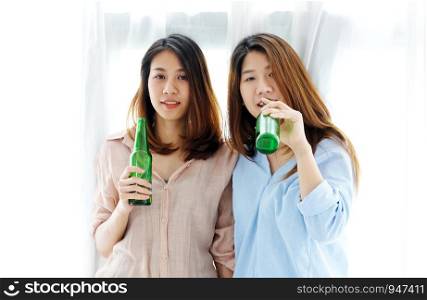 Two asian women drinking beer at party, celebration, LGBT couple, lifestyle