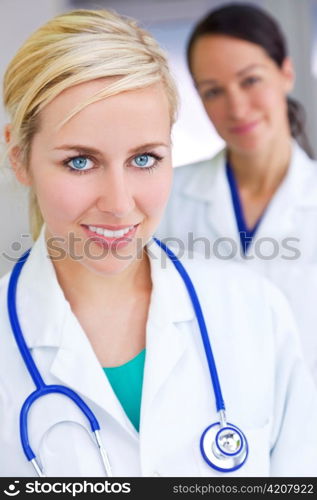 Two Attractive Smiling Women Doctors With Stethoscope