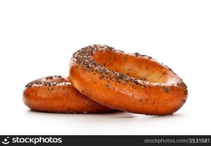 two bagels with poppy seeds isolated on white background