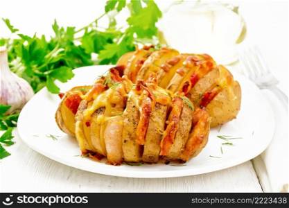 Two baked potatoes layered with smoked bacon and cheese in a plate on a napkin against wooden board background