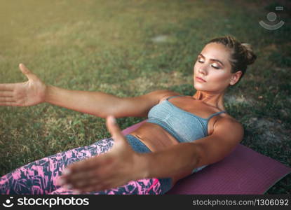 Two basketball players work out tactics on outdoor court. Male athletes in sportswear play the game on streetball training. Two basketball players work out tactics outdoor