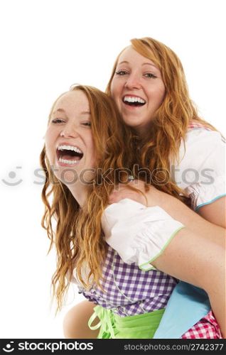 two bavarian dressed girls having fun. two bavarian dressed girls having fun on white background