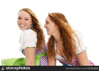 two bavarian girls looking. two bavarian girls looking on white background