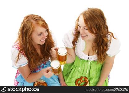 two bavarian women with beer and pretzels. two bavarian women with beer and pretzels on white background
