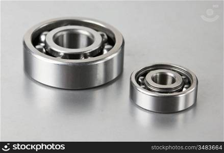 two bearings on the gray metal table
