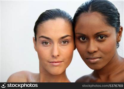 Two beautiful Caucasian and African women