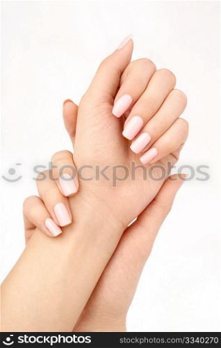 Two beautiful female hands with manicure, isolated